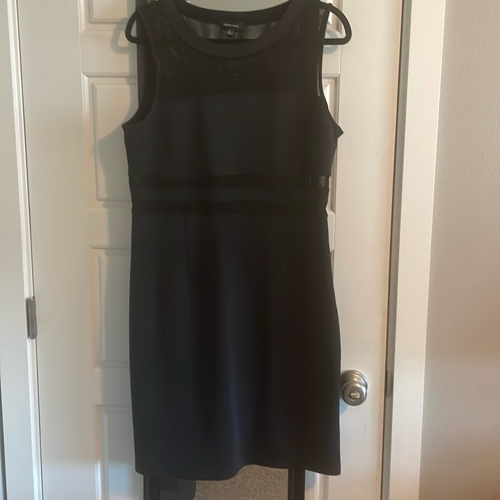 New without tags. Black mesh cut out dress by Spense. Size 12.